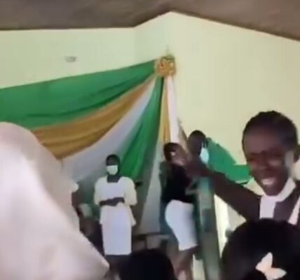 Anglican Priest Caught on camera kissing his female members